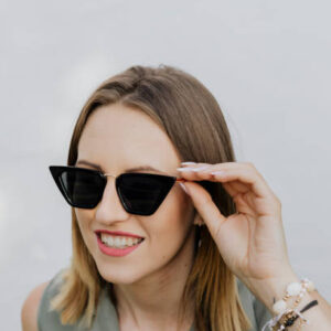 Happy woman in her sunglasses